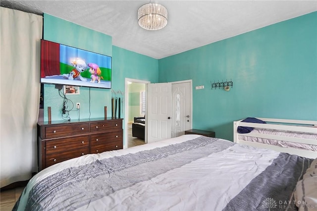 bedroom featuring a notable chandelier