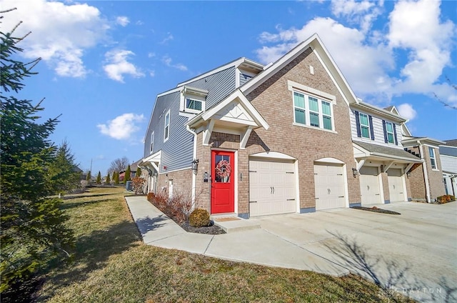 view of front facade with a garage, driveway, and brick siding