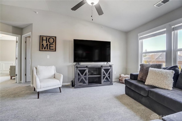 living room with visible vents, carpet flooring, vaulted ceiling, ceiling fan, and baseboards