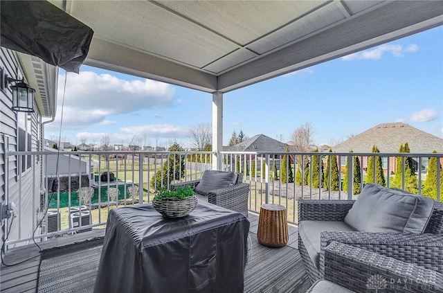 deck with grilling area and outdoor lounge area