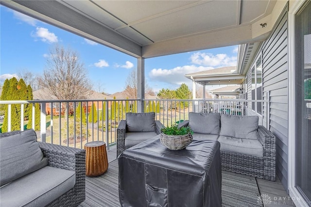 wooden deck with an outdoor hangout area