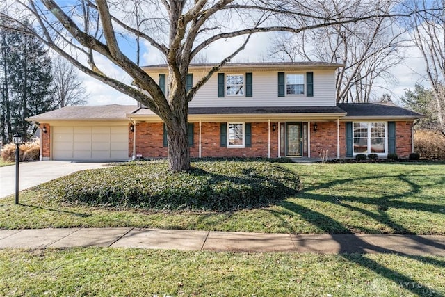 traditional-style house featuring an attached garage, driveway, a front lawn, and brick siding