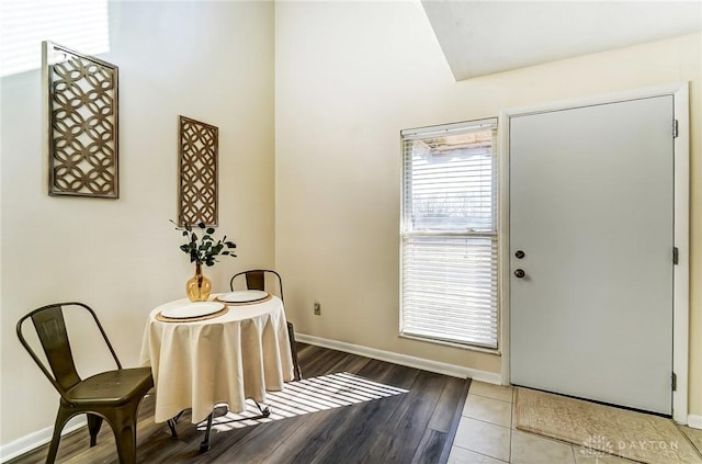 interior space featuring wood finished floors and baseboards