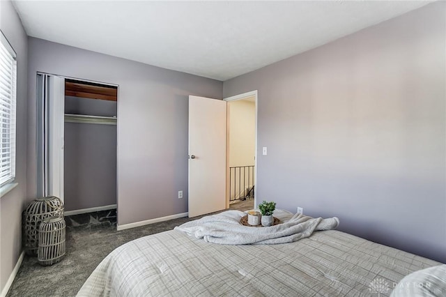 bedroom featuring dark colored carpet, a closet, and baseboards