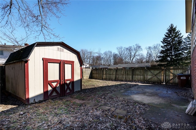 view of shed with a fenced backyard