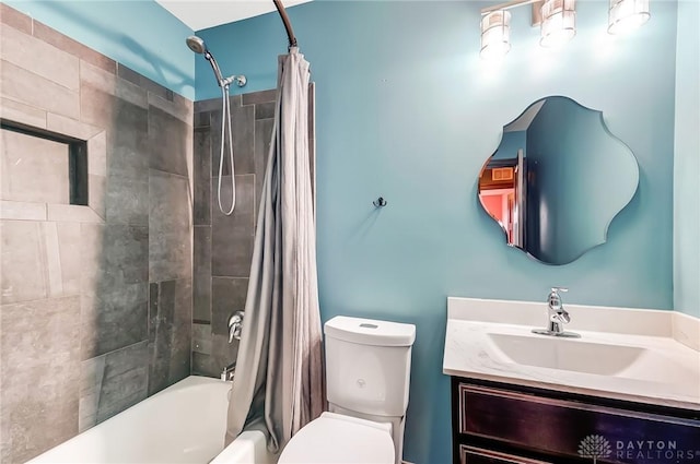 full bathroom featuring shower / tub combo with curtain, vanity, and toilet