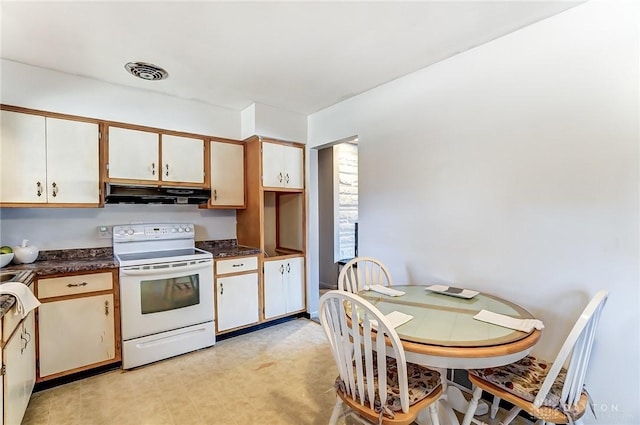 kitchen featuring white electric range oven, visible vents, white cabinets, dark countertops, and under cabinet range hood