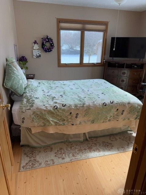 bedroom featuring wood finished floors