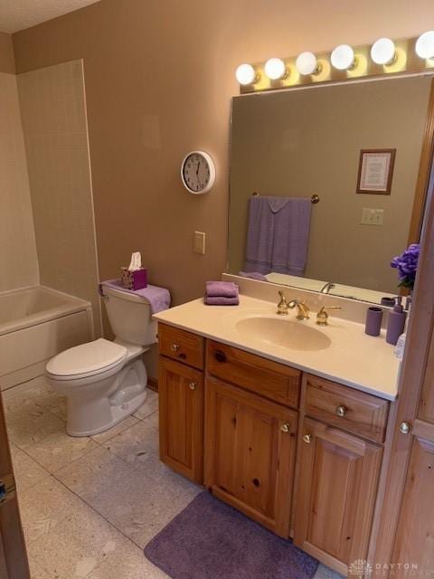 bathroom featuring toilet, washtub / shower combination, and vanity