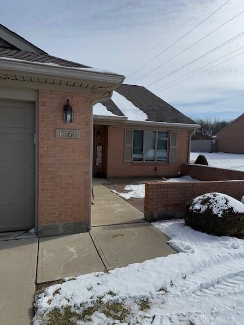 exterior space with brick siding