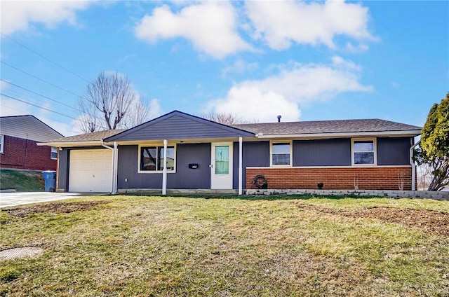 ranch-style home with a front yard, concrete driveway, brick siding, and an attached garage