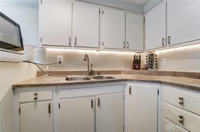 kitchen with white cabinets and a sink