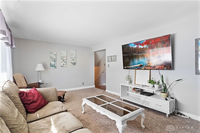 carpeted living room with baseboards