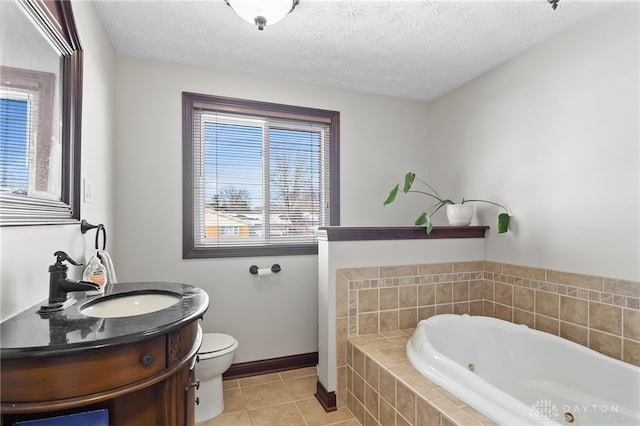 full bathroom with a garden tub, toilet, vanity, a textured ceiling, and tile patterned flooring