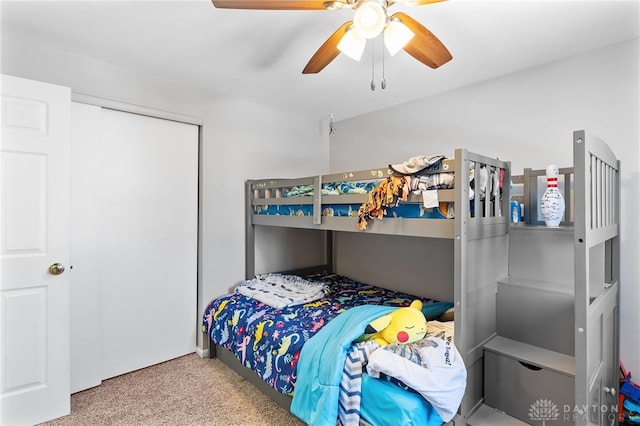 bedroom with carpet floors, a closet, and ceiling fan