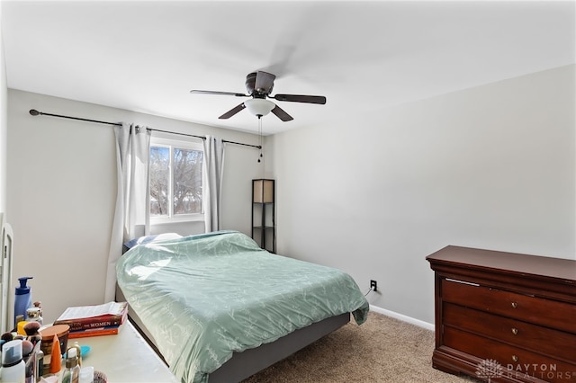 bedroom with light carpet, ceiling fan, and baseboards