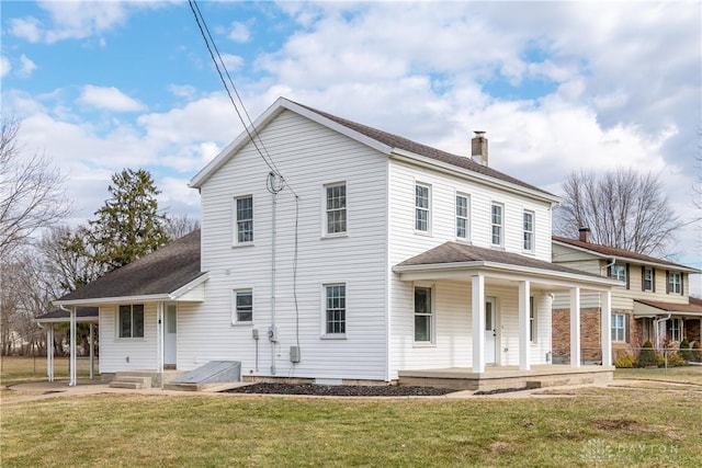 rear view of house with a porch, a lawn, a chimney, and a shingled roof