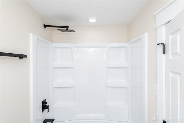 bathroom featuring walk in shower and visible vents