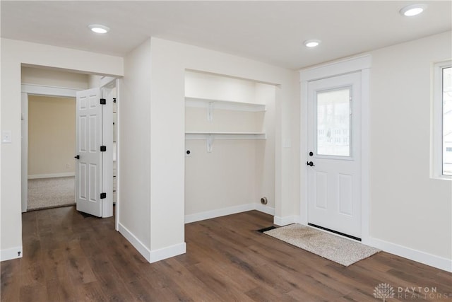 interior space with a wealth of natural light, dark wood-style flooring, and recessed lighting