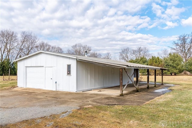 view of outbuilding with an outbuilding and driveway