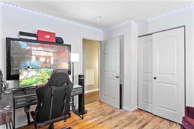 office space featuring light wood-style floors and baseboards