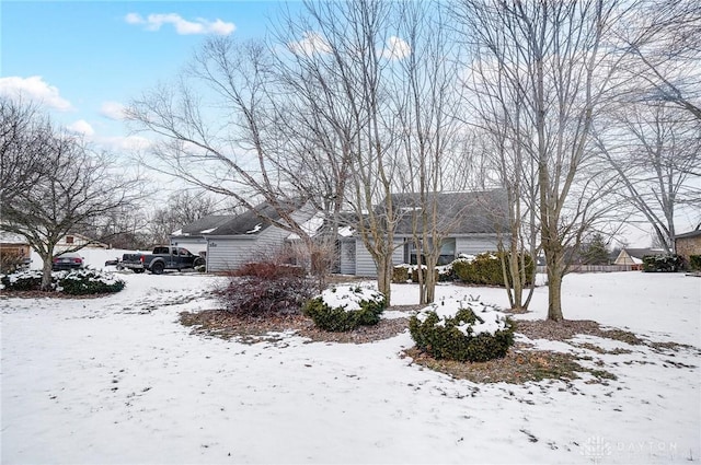 view of yard covered in snow