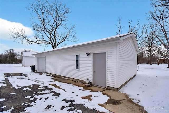 exterior space with a detached garage