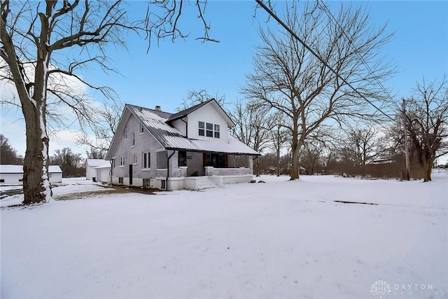 view of front of home featuring a garage and a porch