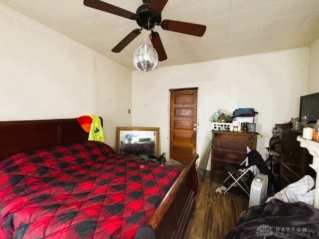 bedroom featuring a ceiling fan and wood finished floors