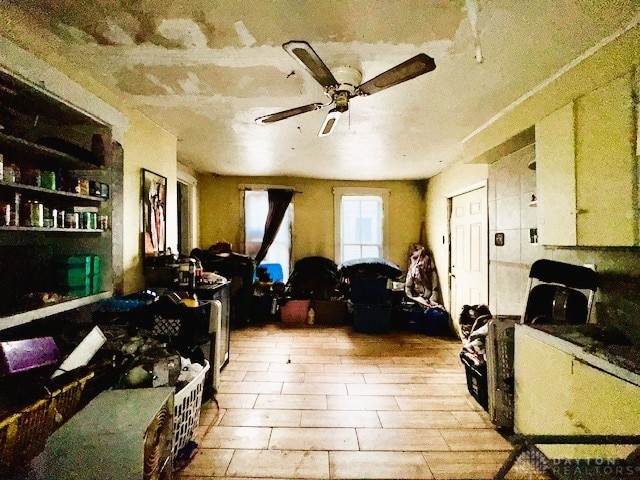 miscellaneous room featuring a ceiling fan