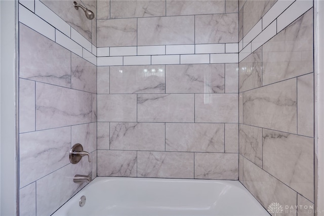 interior details with shower / bathing tub combination