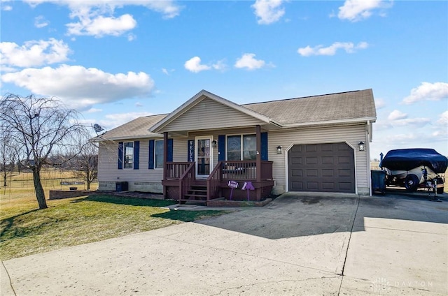 ranch-style home featuring a garage, covered porch, driveway, and a front lawn