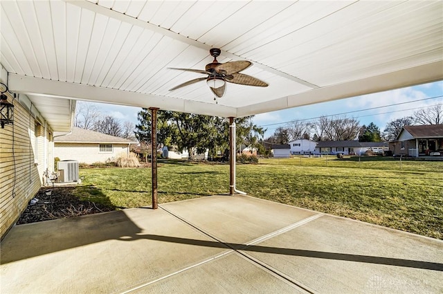 view of patio / terrace with cooling unit, ceiling fan, and a residential view