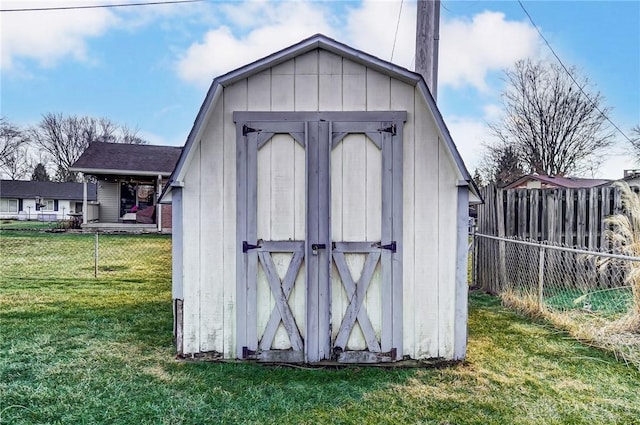 view of shed with fence