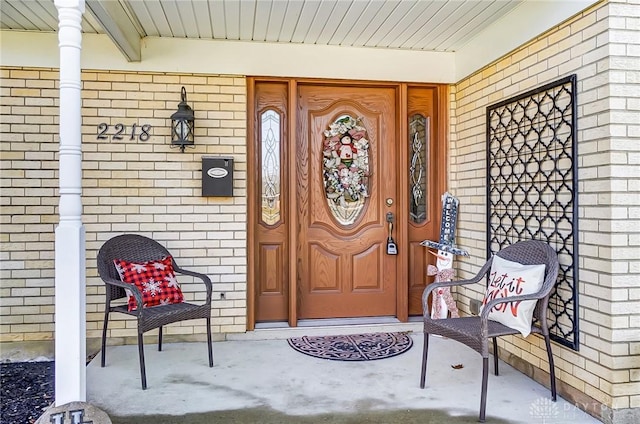 entrance to property with brick siding