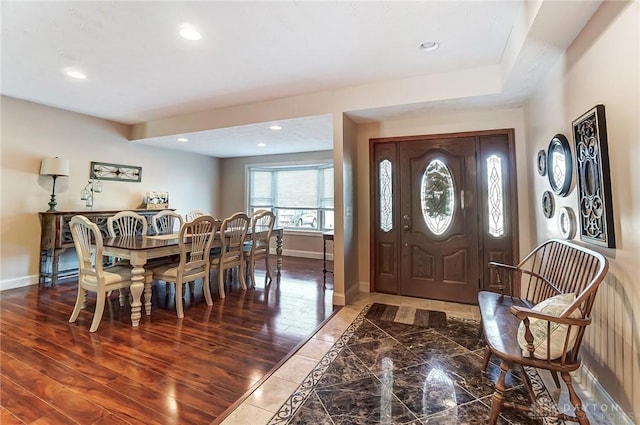 entrance foyer featuring dark wood-type flooring, recessed lighting, and baseboards