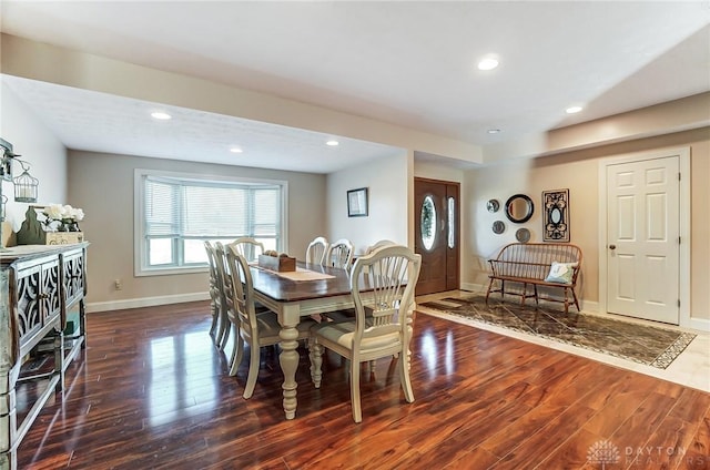 dining area with baseboards, dark wood finished floors, and recessed lighting