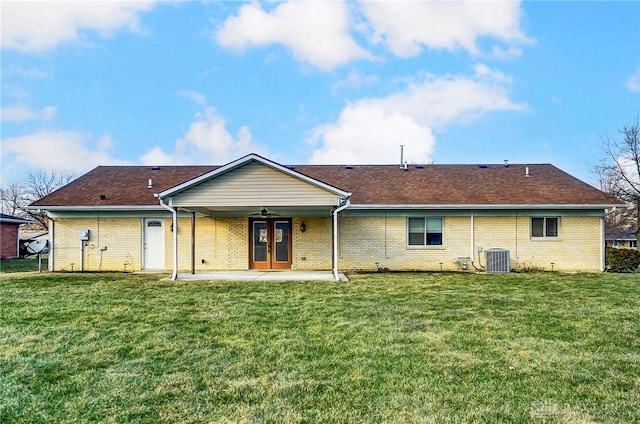 rear view of house with central AC, a yard, a patio, and a ceiling fan