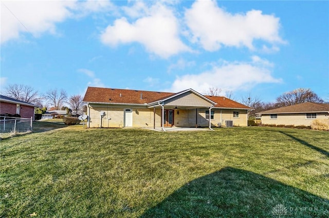 back of house with a patio area, fence, central AC, and a yard