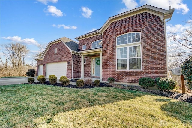 traditional home with a front yard, brick siding, driveway, and an attached garage