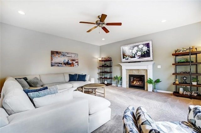 carpeted living area with ceiling fan, a fireplace, baseboards, and recessed lighting