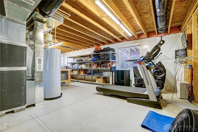 basement featuring water heater and heating unit