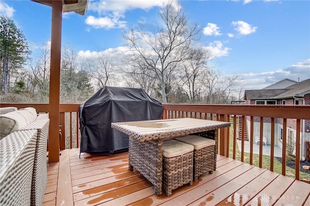 wooden terrace featuring area for grilling