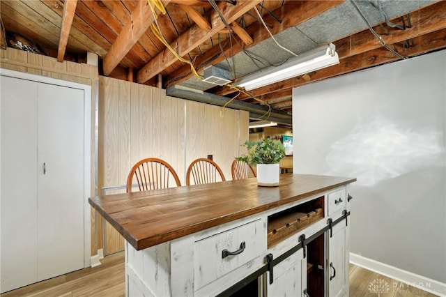 kitchen featuring light wood finished floors and baseboards