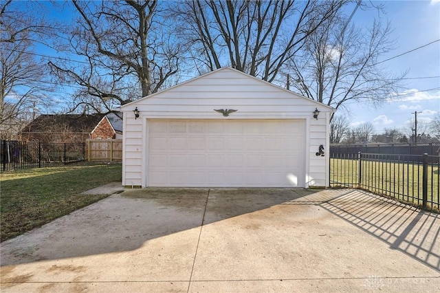 detached garage featuring fence