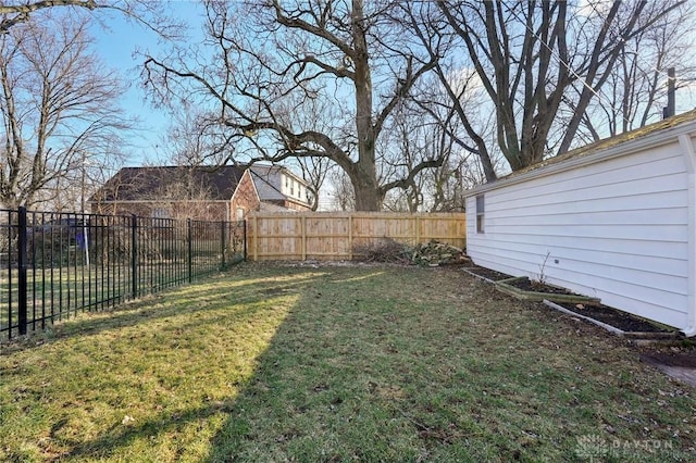 view of yard with a fenced backyard