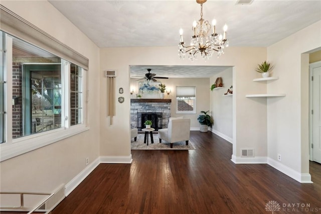 hallway with dark wood-style floors, visible vents, and baseboards