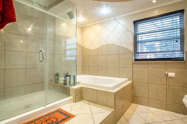 full bathroom featuring a shower stall, a textured ceiling, tile walls, and tile patterned floors