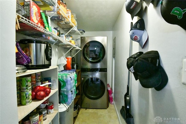 laundry room featuring laundry area and stacked washer and dryer