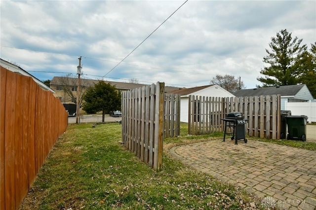 view of yard with a patio area and a fenced backyard